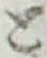 “と”字