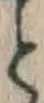 “と”字