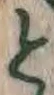 “と”字